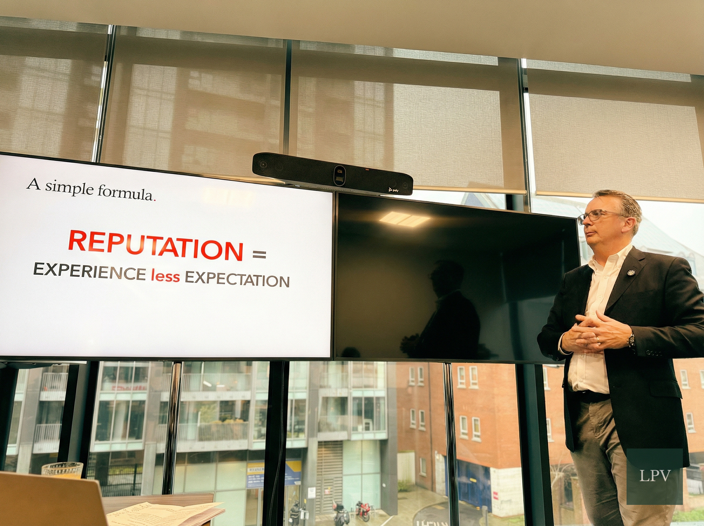 Michael Stewart presenting insights on fostering high-performance teams and corporate culture.