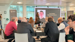 Attendees engaging in discussions on international business expansion at the Corporate Connections Scale Summit.