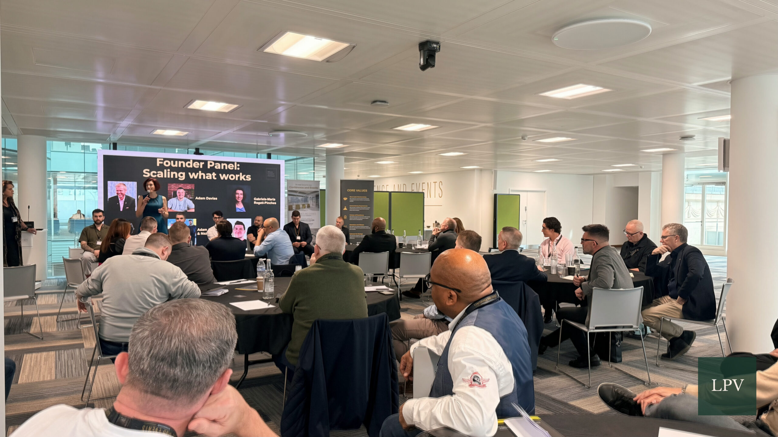 Panel discussion at The Scale Summit on effective scaling strategies with Adam Davies.