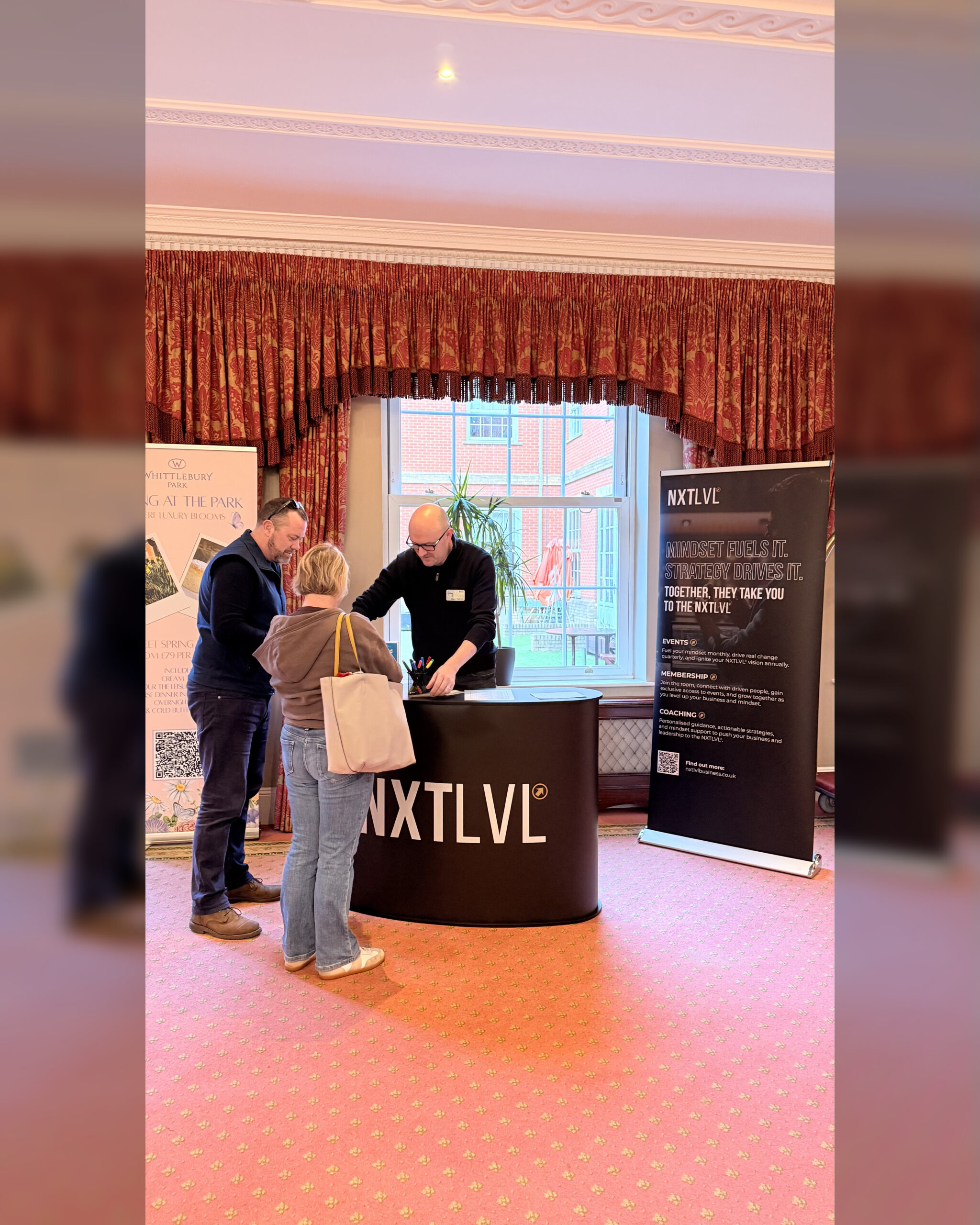 Attendees networking at NXTLVL Business Club launch event at Whittlebury Park for business success.