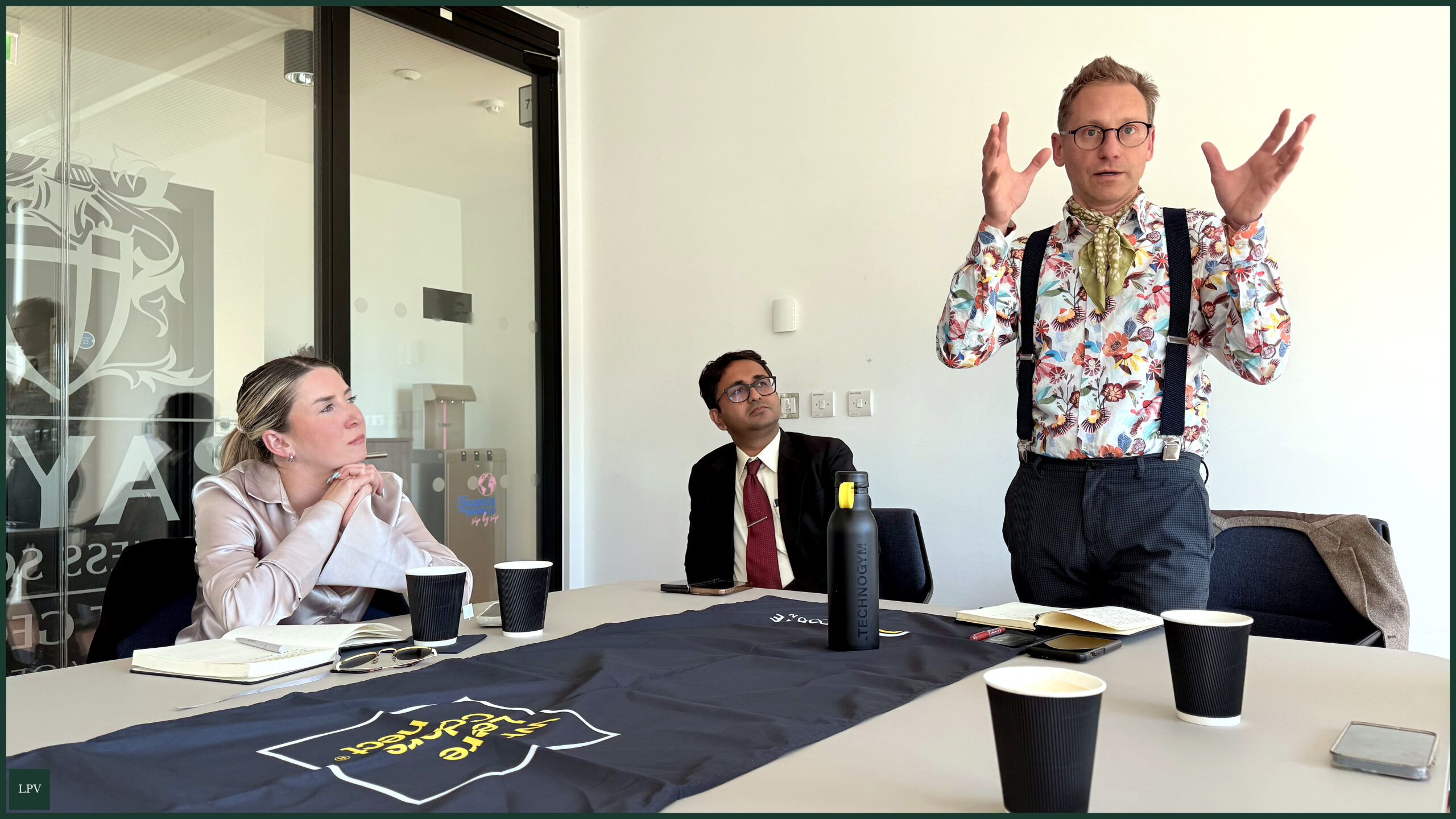 Professionals collaborating at Corporate Connections meeting, Bayes Business School, fostering innovative visions.
