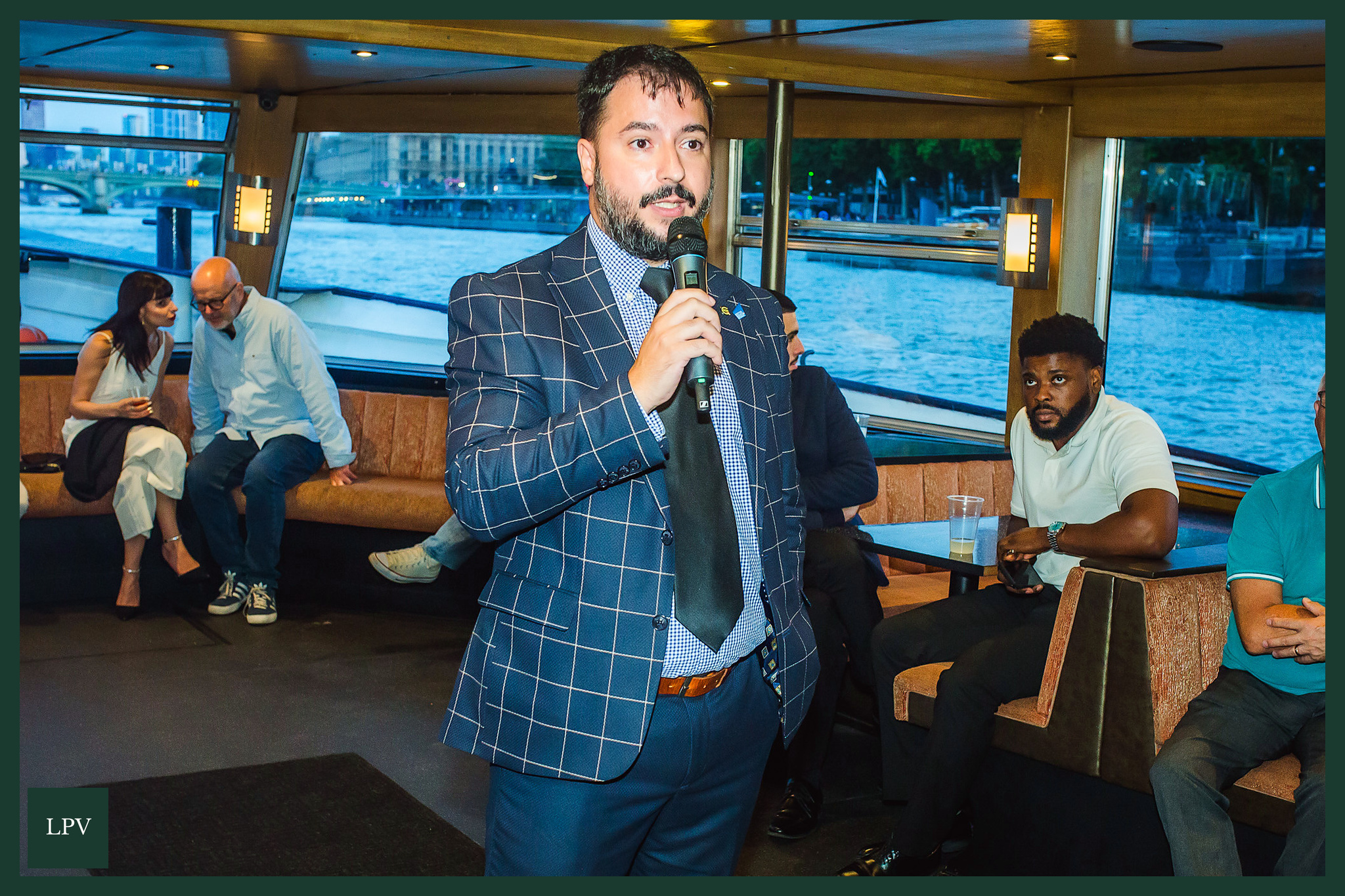 Russell Dalgleish with male business owner at Thames networking event, London