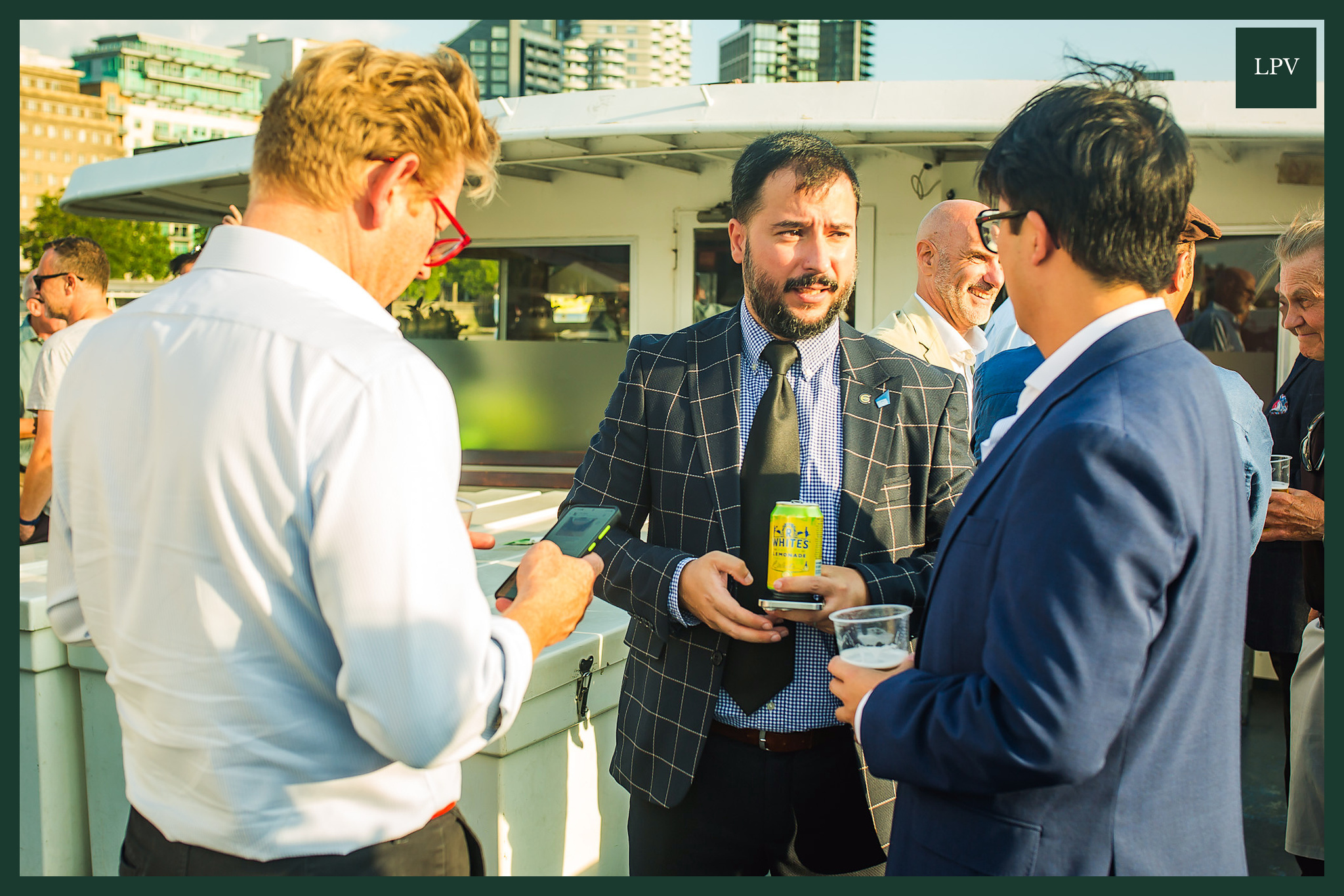 Russell Dalgleish with male business owner at Thames networking event, London