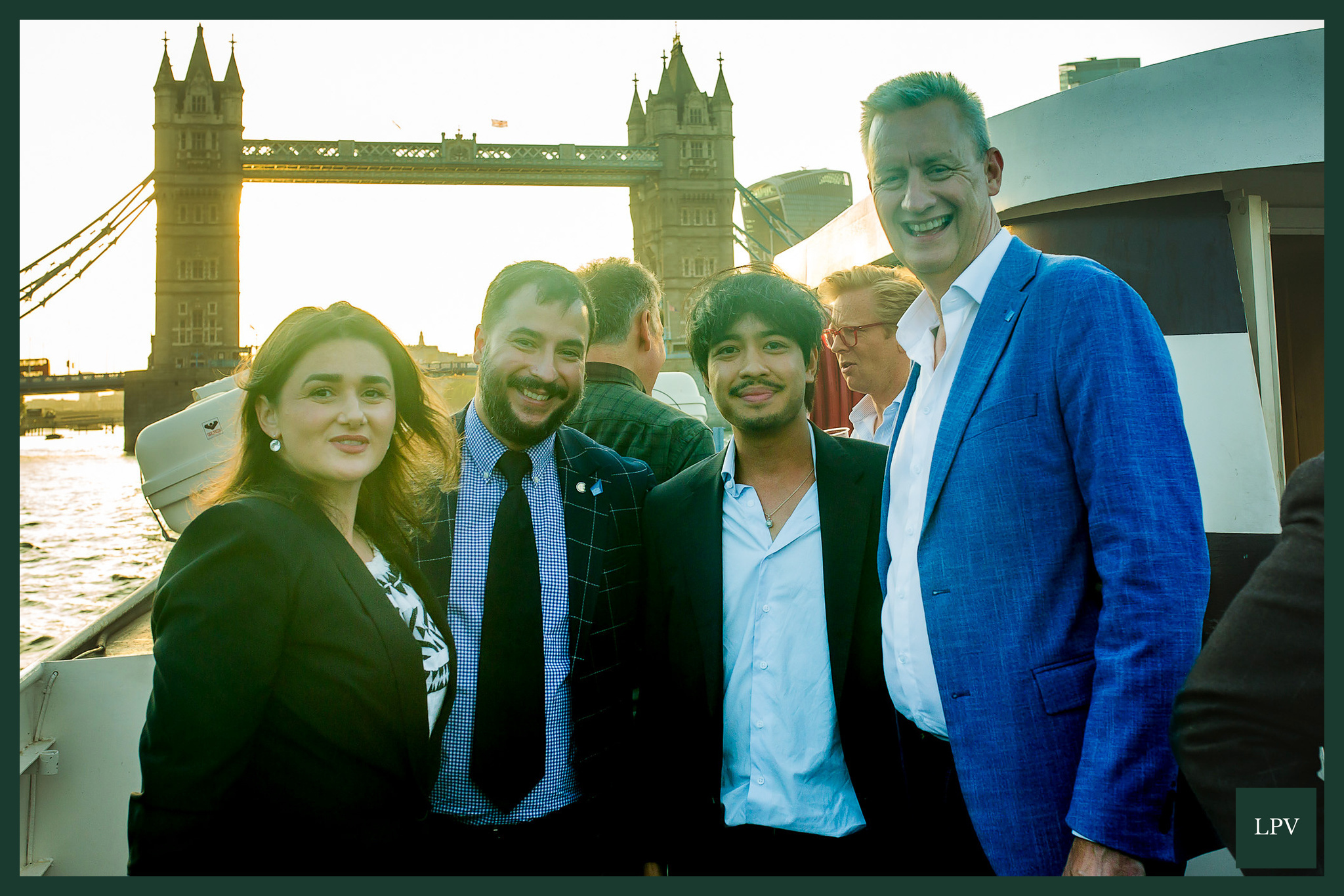 Russell Dalgleish adjusts height beside Alex at Thames networking event in London