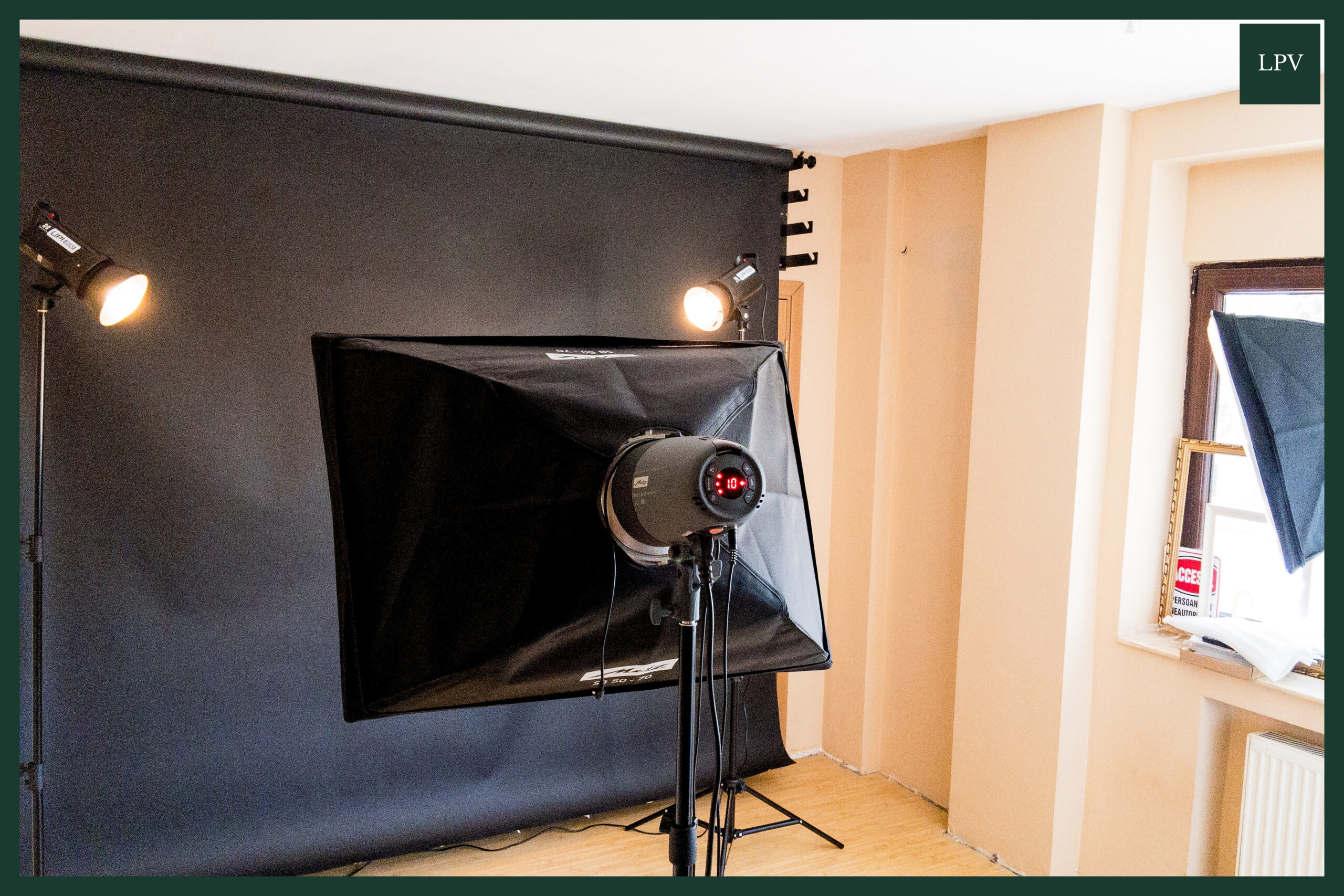 Studio softboxes, black backdrop and cables prepared for B2B video marketing agency London shoot